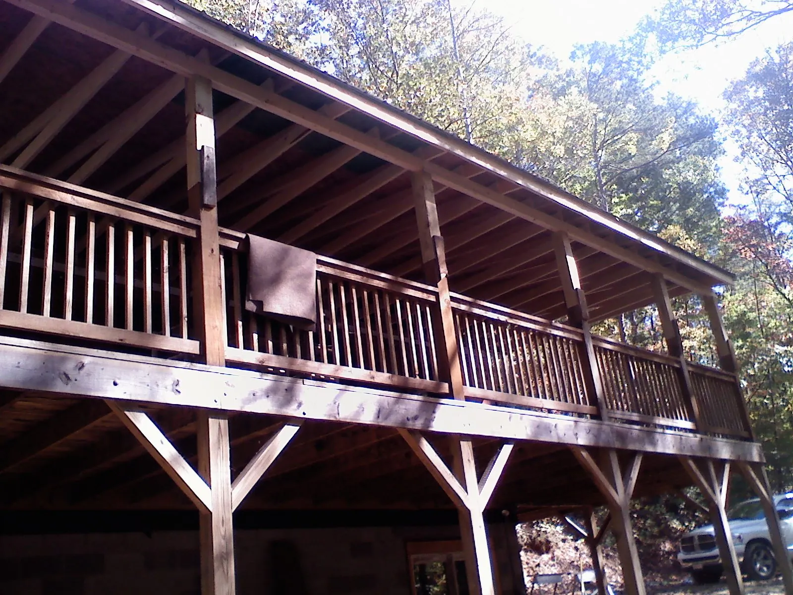 Timber framing under a new elevated porch and deck — Roof Leak Repair in Cabins by Roofing Brothers